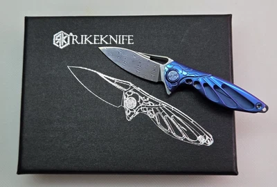 Rike Mini Hummingbird: 1.57" Rose Damascus Blade, Blue Titanium Framelock Knife - Image 1 of 4