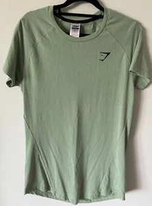 Gymshark Women’s Size M T Shirt Miss Green Curved Hem Sellout Graphics On Back - Picture 1 of 8