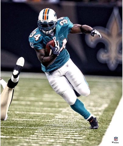 Ricky Williams Miami Dolphins Unsigned Teal Jersey Running Photograph Cover