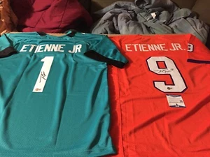 Camisetas XL firmadas por Travis Etienne Jaguars & Clemson Tigers - Beckett Witnessed - Imagen 1 de 10