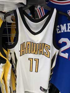 trae young white and gold jersey