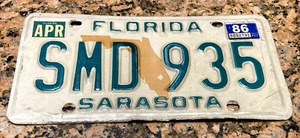 April 1986 Florida Nummernschild SARASOTA County '86 FL Tag SMD 935 invert ERROR - Bild 1 von 3