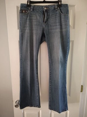 Pantalones de mezclilla elásticos con bolsillos azules Stamp 10 para mujer 12 Foto 1 de 4