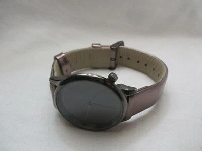 Reloj Pulsera The Estelle Komono Negro Hebilla Banda Cara Redonda Simple Elegante Foto 1 de 4