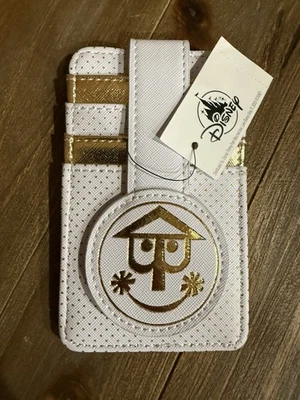 Cartera blanca y dorada Small World de los parques de Disney Foto 1 de 2