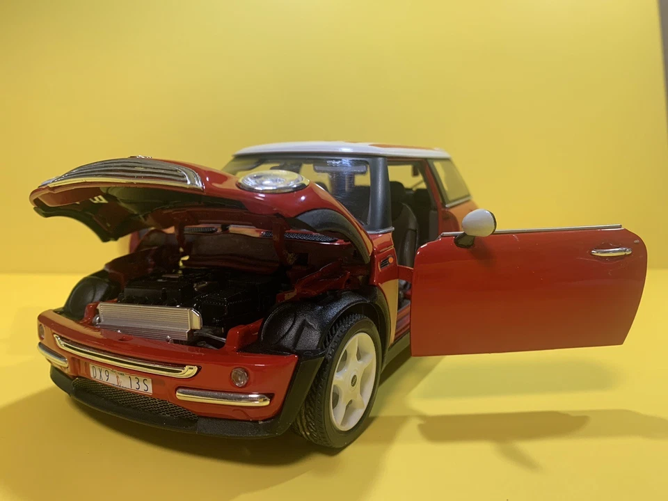 Burago 1/18 Scale 2001 Mini Cooper Hatch Red with American Flag on White Roof - Image 1 of 4