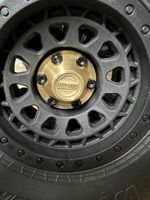 Axial Scx6 Center Wheel Hub Caps In Brass Set Of 4 With Machined Locker Details. - Image 1 of 4