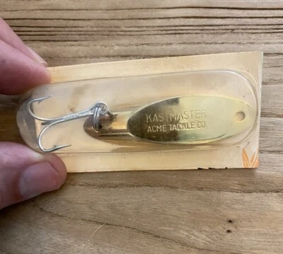 Isca de pesca vintage Kastmaster Acme Tackle Co. colher dourada gabarito NOS - Imagem 1 de 4