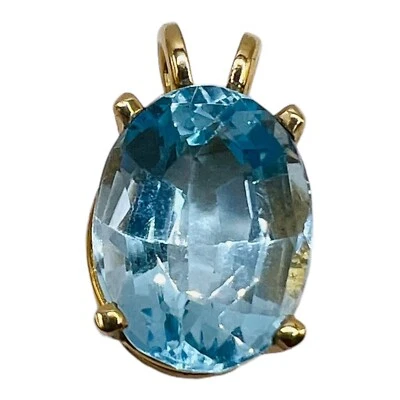 Colgante ovalado topacio azul cielo oro amarillo 14k natural de 9,00 quilates 15 mm Foto 1 de 4