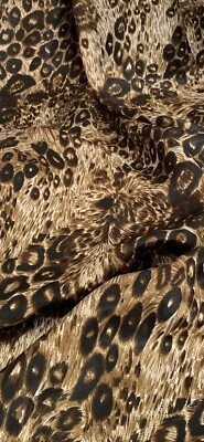 Tela satinada con estampado de leopardo negro dorado 58"" precio por metro Foto 1 de 2
