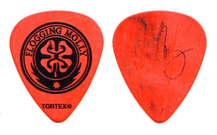 Flogging Molly Dennis Casey Signature Concert-Used Orange Guitar Pick 2014 Tour - Image 1 of 1