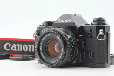 US Duty Paid [N NEUWERTIG] Canon AE-1 Program 35mm Film Camera + NFD 50mm f1.8 JAPAN - Bild 1 von 4