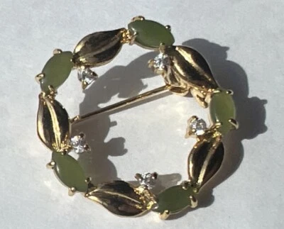 Broche broche de eternidad círculo de jade con piedras transparentes conjunto de puntas tono dorado Foto 1 de 4