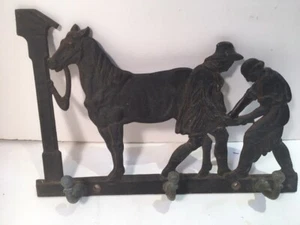 ANTIQUE VINTAGE IRON WALL HOOKS MEN SHOEING HORSE SCULPTURE - Picture 1 of 7