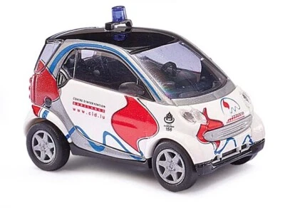 Scala H0 M : 1:87 Busch 46156 Smart Fortwo» Pompieri & Protezione Civile« Nuovo - Immagine 1 di 2