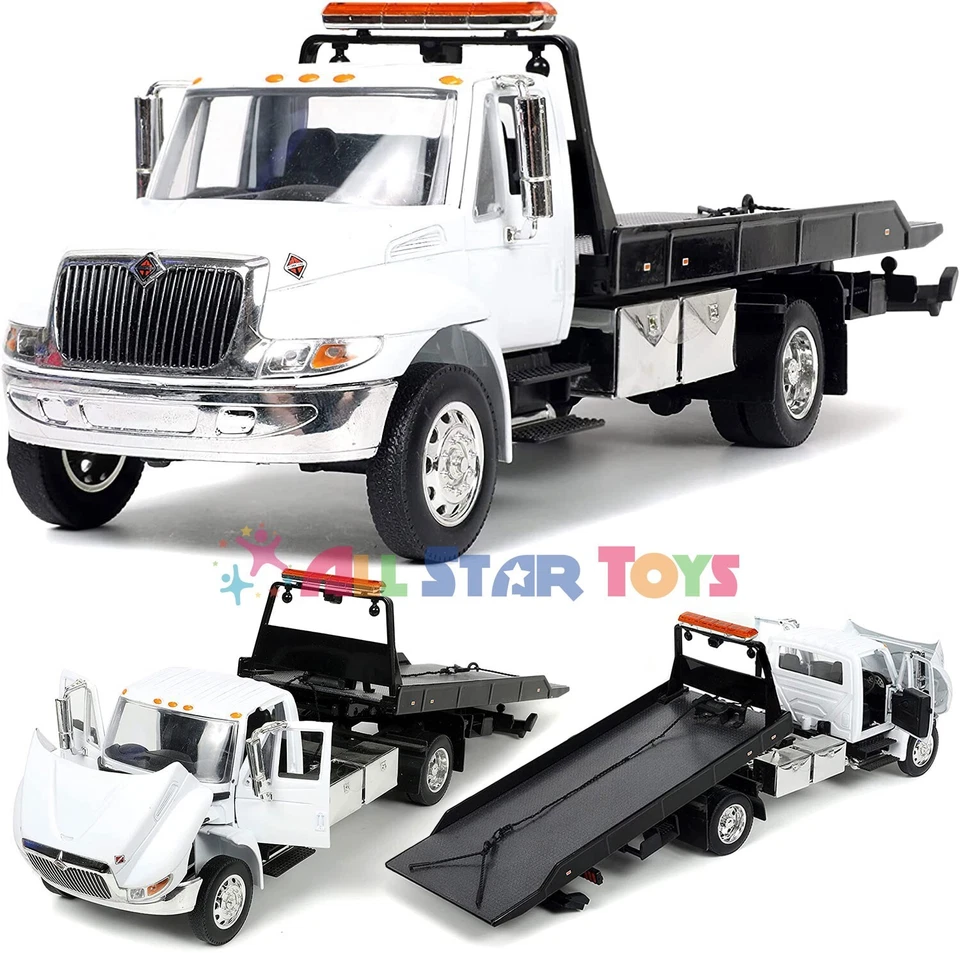 JADA 34040 INTERNATIONAL DURASTAR 4400 FLAT BED TOW TRUCK 1/24 DIECAST MODEL - Image 1 of 4