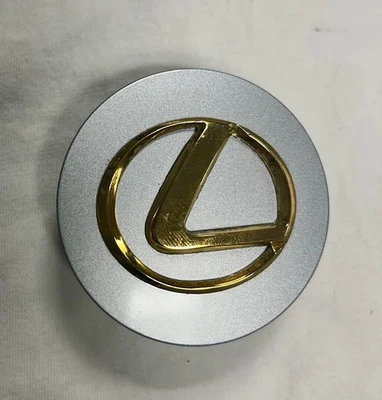 42603-24250 OEM LEXUS GOLD CENTER CAP GS SC LS430 RX ES IS HS ANY 2.5" diameter - Image 1 of 2