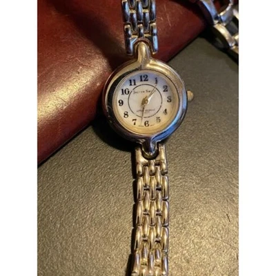 Reloj pulsera mujer tono plata con dije, bisel y pulsera acentuados en cristal Foto 1 de 3