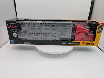 1/43 New-Ray Peterbilt Model 387 Truck and Livestock Hauler Trailer Red  - Image 1 of 4