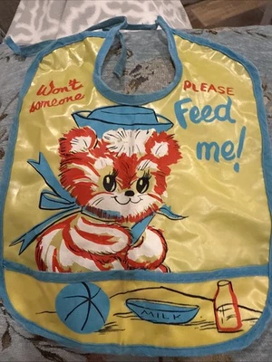 Babero de vinilo de plástico para niños pequeños de colección con bolsillo para atrapar migas multicolor gato genial Foto 1 de 4