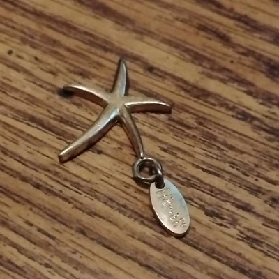 Starfish Charm with tag that says "Aloha"on one side and "Hawaii" on the other  - Image 1 of 4