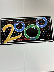 VTG WDW Walt Disney World 2000 License Plate Celebrate the Future Hand in Hand - Picture 1 of 2