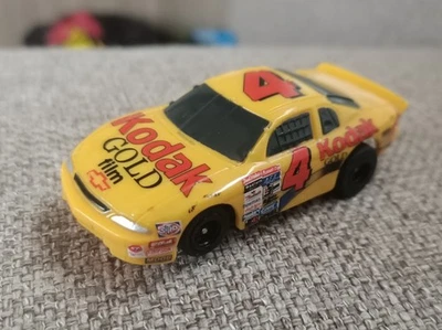 Afx Tomy Kodak Yellow/Gold Chevy #4 Nascar Stock Car Monte Carlo  - image 1 of 4