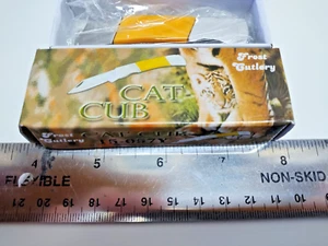 Cat Cub folding mini knife with yellow handle. - Picture 1 of 2