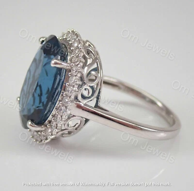 Помолвочное кольцо из белого золота 14 карат с голубым топазом и бриллиантами ореолом овальной огранки 4 карата - Изображение 1 из 4