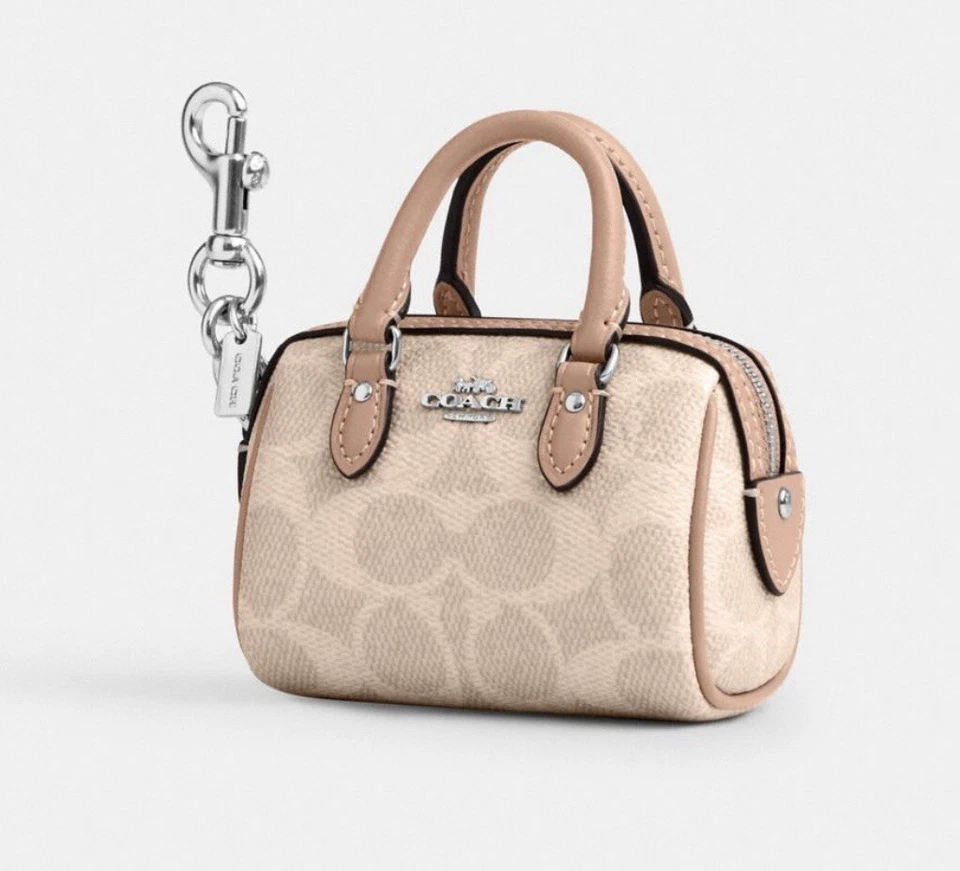 Coach Mini Rowan Bag Charm Signature Canvas Gold/Powder Pink CX068