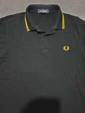 fred perry black & gold polo shirt
