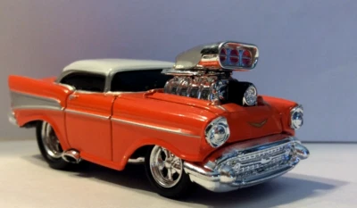 MUSCLE MACHINES 1957 CHEVY --  DIECAST CAR 1/64 - 57 CHEVY -- ORANGE  - Image 1 of 4