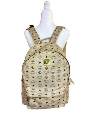 MCM Visetos Stark Studded Backpack with a cream monogram pattern. - Image 1 of 4