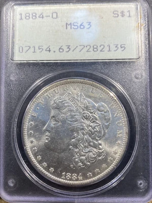 Dólar de plata Morgan 1884-O graduación profesional MS63 ANTIGUO SOPORTE VERDE SONAJERO ¡OGH!! Foto 1 de 4