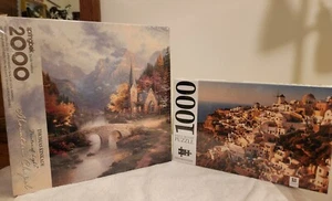 Thomas Kinkade Mountain Chapel 2000pc Puzzle W/1000 PC Santorini Puzzle Set - Picture 1 of 7