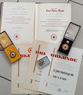 Ehrenzeichen des Deutschen Roten Kreuz der DDR Bronze und Silber und Urkunden - Bild 1 von 2
