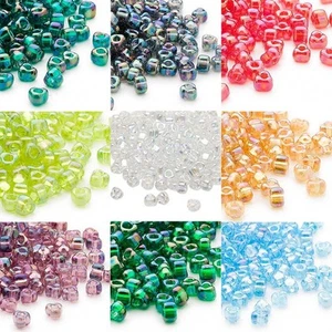 100 cuentas de semillas en forma de triángulo Miyuki de vidrio 4 mm 5/0 con elegante acabado de iris AB - Imagen 1 de 10