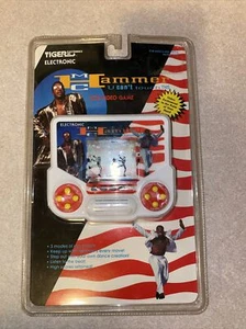 1991 MC Hammer Tiger Electronics Can't Touch Questo videogioco portatile SIGILLATO NOS - Foto 1 di 5