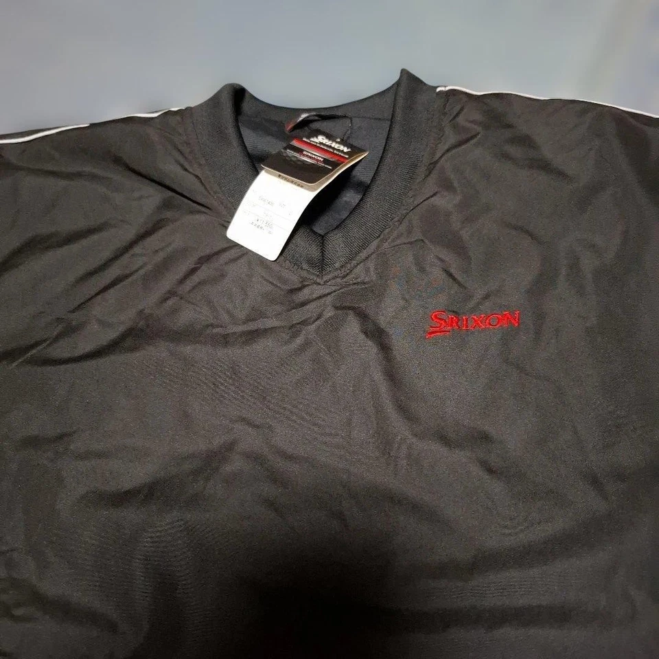 Chaqueta de golf Srixon negra de manga larga con mangas desmontables, líneas laterales blancas Foto 1 de 4