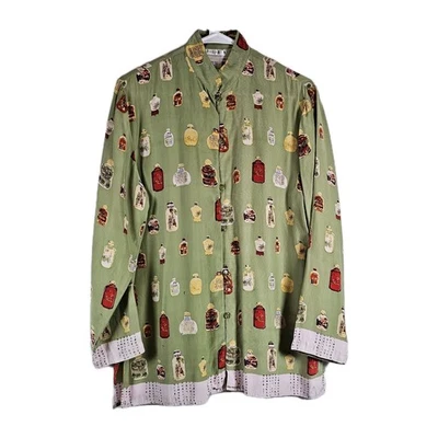 Blusa para mujer marca Piano mediana 100 % seda verde con estampado integral abotonada  Foto 1 de 4