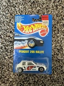 Hot Wheels PEUGEOT 205 RALLYE - 1989 BLUE CARD International ONLY #3 Pirelli NEW - Picture 1 of 2
