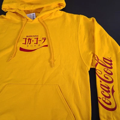 Nuevo con etiquetas Sudadera Japonesa Coca-Cola Amarilla Sudadera con Capucha Mediana Para Hombre Nueva Foto 1 de 4
