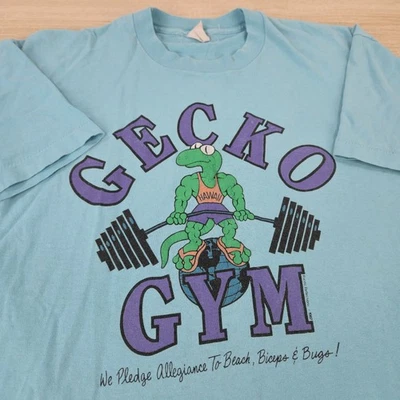 Camisa dourada vintage anos 80 1987 XL Fruit of The Loom Gecko Gym Graphic Pump World - Imagem 1 de 4