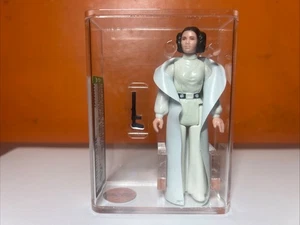 PRINCESA LEIA ORGANA PELO CASTAÑO Y CINTURÓN STAR WARS 1977 KENNER HK AFA GRADO 75 - Imagen 1 de 6