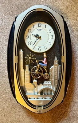 Rhythm Small World Musical Motion Wall Clock – Model 4MH691-R02 “Bicycle World” - Image 1 of 4