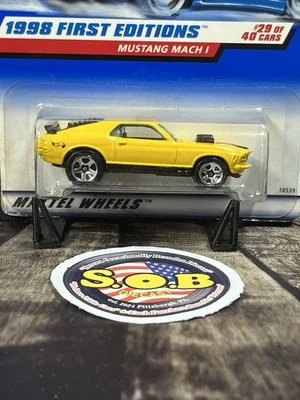 Ford Mustang Mach I 1970 primeras ediciones Hot Wheels amarillo diecast sellado casi nuevo estado Foto 1 de 4