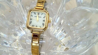 Reloj para mujer Anne Klein esfera mop tono dorado Y121E (259) Foto 1 de 4