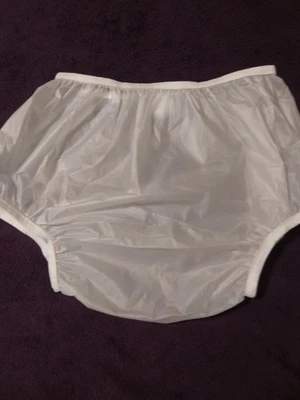 Pantalones de plástico vintage para adultos Foto 1 de 3