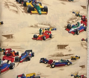 Coches de carreras con serigrafía VIP de 1 yarda Cranston Print Works en tela amarilla 44" - Imagen 1 de 10