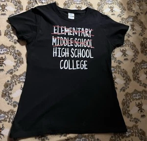 black t-shirt with white text that says "ELEMENTARY MIDDLE HIGHSCHOOL - Picture 1 of 1